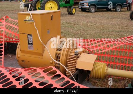 Large power take off PTO shaft electric generator driven by a farm tractor Stock Photo