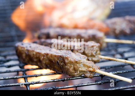 Food being grilled on the barbeque. Stock Photo