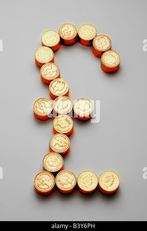 Stacks of one pound coins, made into a pound sign. Stock Photo