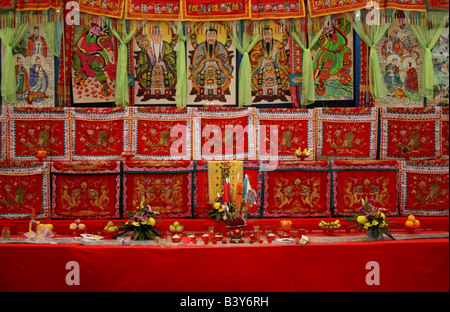 Alter of offerings with the Three Pure Ones and taoist deities, Taoist festival of the hungry ghosts, Singapore, South East Asia Stock Photo