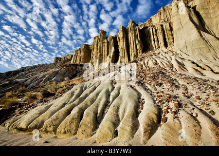 Eroded cliff with puffy clouds Red Rock Canyon State Park California Stock Photo