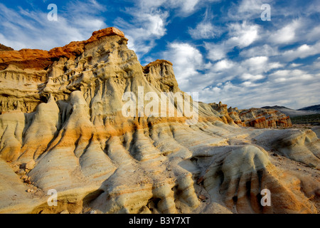 Puffy clouds and colorful sandstone rocks at Red Rock Canyon State Park California Stock Photo