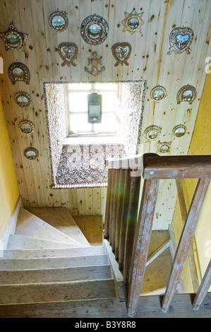 Scotland, Inner Hebrides, Jura. A shell encrusted window sill on a staircase in GlenBatrick Lodge. The lodge overlooks the white sandy shore of Loch Tarbert on the west side of Jura. Beautifully isolated the lodge is only accessible by boat or a five hour walk. Stock Photo