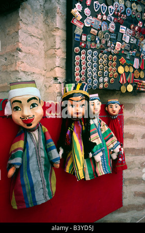 May 13, 2006 - Memorabilia from the Soviet era and glove puppets for sale outside a souvenir shop in the Uzbek city of Buchara. Stock Photo