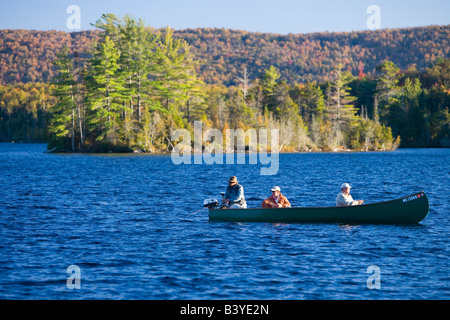 Fishing from a canoe on Prong Pond near Moosehead Lake in Maine. (MR) Stock Photo