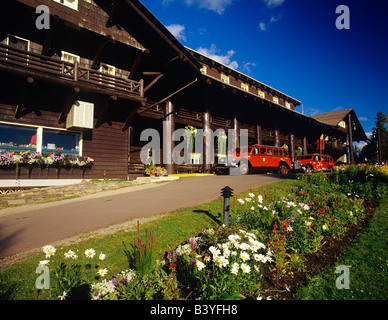 Red jammer buses parked in front of Glacier Park Lodge in East Glacier Montana Stock Photo