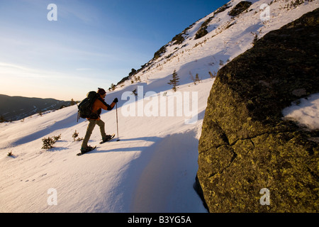 A man snowshoes in Tuckerman Ravine in New Hampshire's White Mountains. (MR) Stock Photo