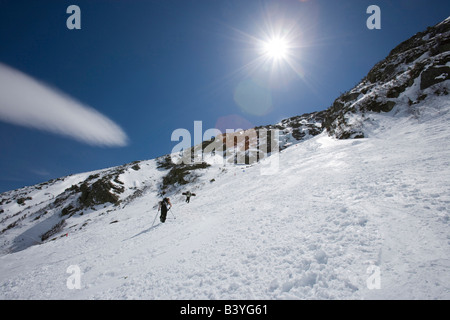 Skiers climbing Tuckerman Ravine in New Hampshire's White Mountains. White Mountain National Forest. April. Stock Photo