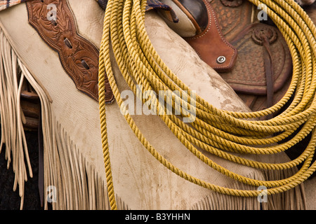 USA, Oregon, Seneca, Ponderosa Ranch. Detail of saddle, chaps, and lasso.  (MR) (PR) Stock Photo