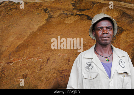 A guide stands in front of the White Lady, a 2000 year old Bushman rock painting at Brandberg, Namibia. Stock Photo