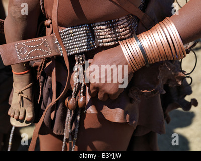 Namibia, Kaokoland. Himba ornaments worn by a woman. Himba women smear their bodies with a mixture of red ochre, butterfat and h Stock Photo