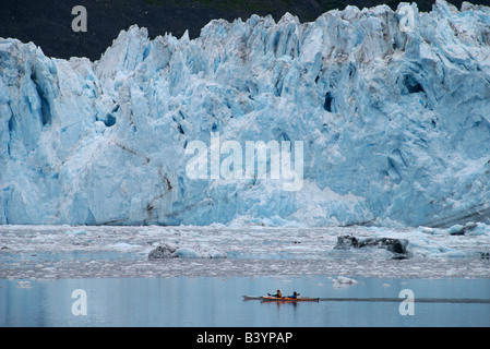 Sea kayakers paddle past Barry glacier in the Prince William Sound, Alaska Stock Photo