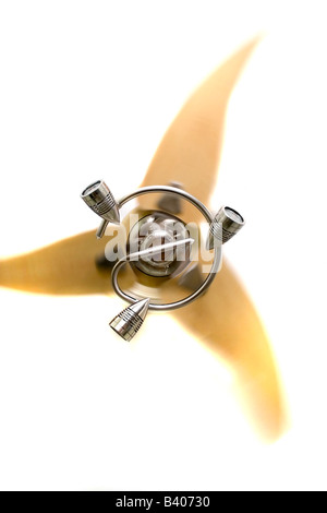 A modern ceiling fan with only three blades while in motion Stock Photo