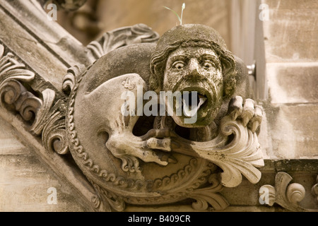 A cheeky looking Gargoyle on the North Transcept of London's Westminster Abbey. Stock Photo