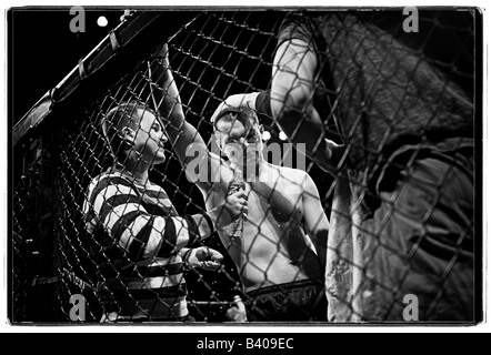 Cage fighter during break in fighting. Stock Photo