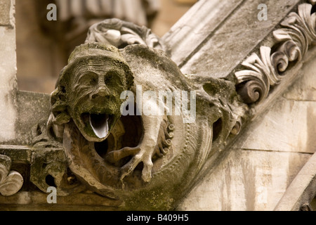 A cheeky looking Gargoyle on the North Transcept of London's Westminster Abbey. Stock Photo