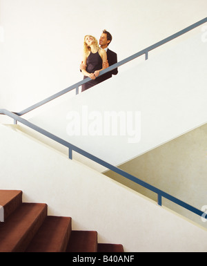 Young couple flirting on a staircase Stock Photo