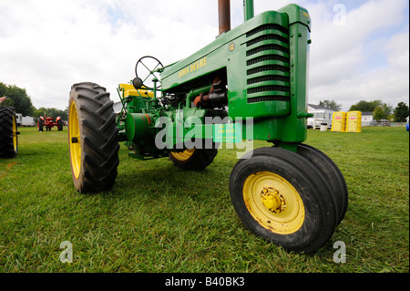 Old 1947 John Deer farm tractor on display at historic farm demonstration Michigan Stock Photo