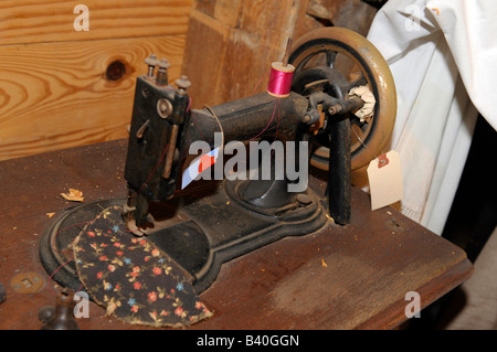 Old antique foot driven sewing machine Stock Photo