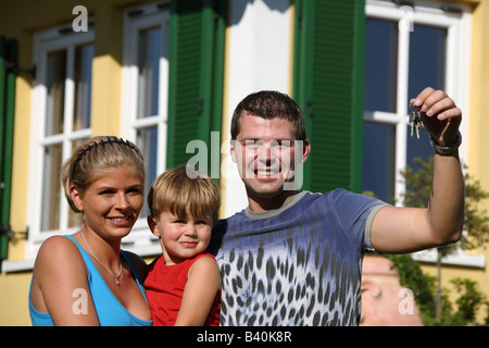 couple in front of newly bought house Stock Photo