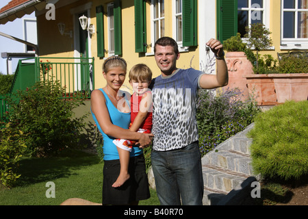 couple in front of newly bought house Stock Photo