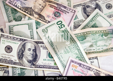 A pile of fifty and one hundred dollar bills Stock Photo
