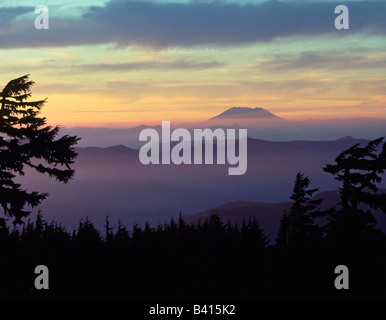 USA, Washington. Mount St. Helens seen through fog layers at sunset as viewed from Mt. Hood Wilderness in Oregon. Stock Photo