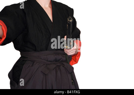Female martial art fighter - performance in a traditional outfit Stock Photo