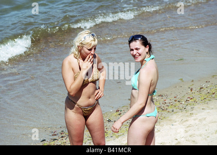 Two young women in bikinis at the Baltic Sea, Selenogradsk, Russia Stock Photo