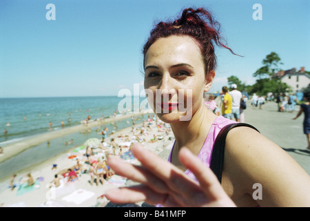 A female tourist on a promenade in Selenogradsk, Russia Stock Photo