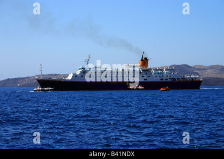 The Golden Prince cruise ship disembarking passengers at Fira port Santorini. Stock Photo