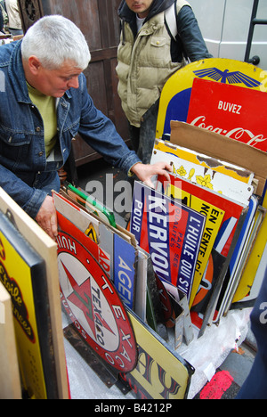 mixed collection of enamel signs at Lille Braderie France Stock Photo