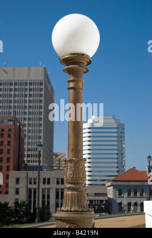 View of downtown Richmond, Virginia from the side steps of the Virginia State Capitol building. Lightpost in foreground. Stock Photo