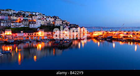 The small fishing town of Brixham on the South Devon coast just before sunrise whilst the sky is still dark Stock Photo