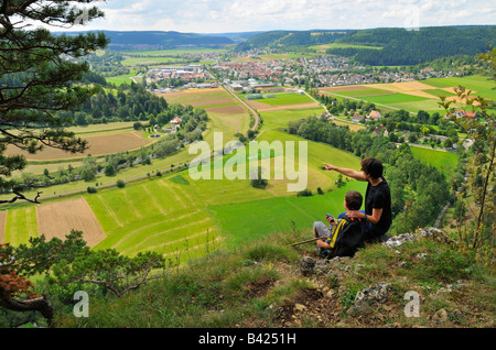 Mother and child enjoy the view towards Mühlheim an der Donau, Naturpark Obere Donau, Baden-Württemberg, Germany