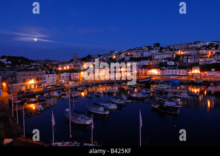 The small fishing town of Brixham on the South Devon coast just before sunrise whilst the sky is still dark Stock Photo
