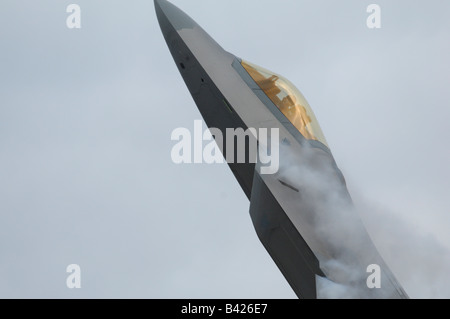 Modern & stealth american jet fighter F-22A Raptor in flight- cockpit & pilot -Arctic Thunder airshow 2008-Anchorage-Alaska-USA Stock Photo