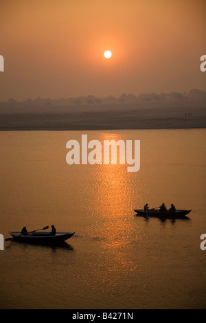 Two boats out on the river Ganges in the city of Varanasi, India. Stock Photo