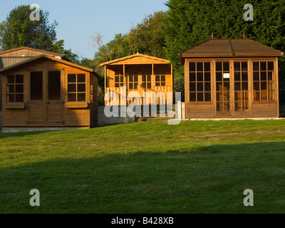 Display of wooden garden sheds for sale at a British 