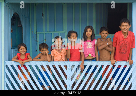 A portrait of a group of 7 Brazilian children in a small village by the Madeira River. Stock Photo