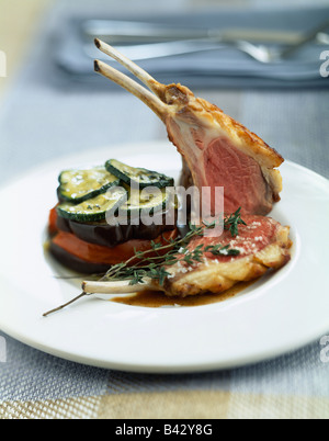 Lamb chops with summer vegetables Stock Photo