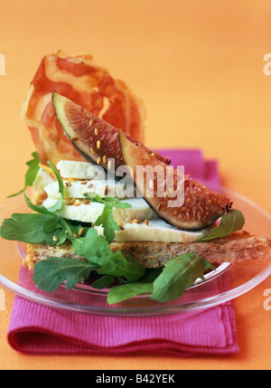 American wholemeam bread with figs and goat cheese Stock Photo