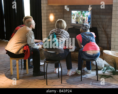 Group of people watching video display in museum Netherlands Stock Photo