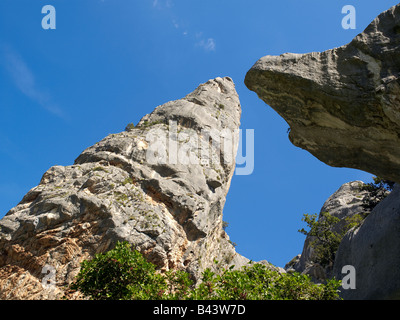 A mighty limestone rock at the east coast of Sardinia at the Golfo di Orosei Stock Photo