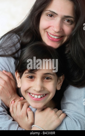 Mother and daughter looking into camera Stock Photo