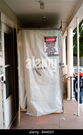 Entrance door to asbestos abatement work area Stock Photo