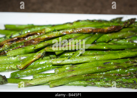 Stir fried cooked whole asparagus spears Stock Photo