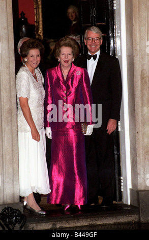 Margaret Thatcher with John Major MP Prime Minister and wife Norma Major outside 10 Downing Street Stock Photo