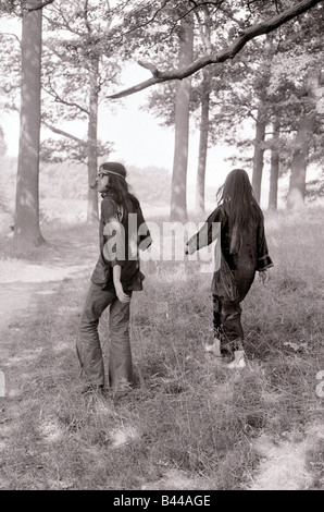 Hippy Festival Windsor Great Park August 1972 Groups of hippies from all over the world camping in the open sheltered by big oak trees and cooking in the bushes Stock Photo