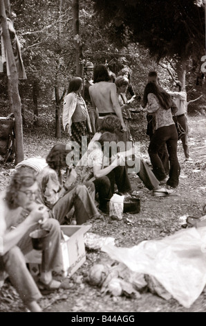 Hippy Festival Windsor Great Park August 1972 Groups of hippies from all over the world camping in the open sheltered by big oak trees and cooking in the bushes Stock Photo